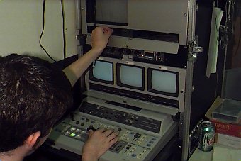 A student using the mixer in the Sanborn TV station.